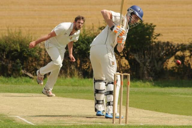 Staxton 2nds' Dan Outhart sends down a delivery during his side's win at Wold Newton in Division One.