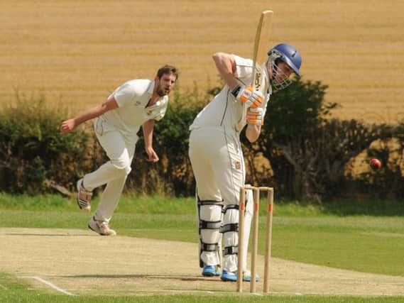 Staxton 2nds' Dan Outhart sends down a delivery during his side's win at Wold Newton in Division One.