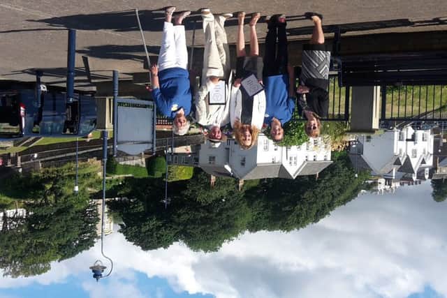 Optimistic Filey in Bloom members are pictured with the Britain in Bloom judges during the visit