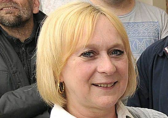 Andrea Woolcott.