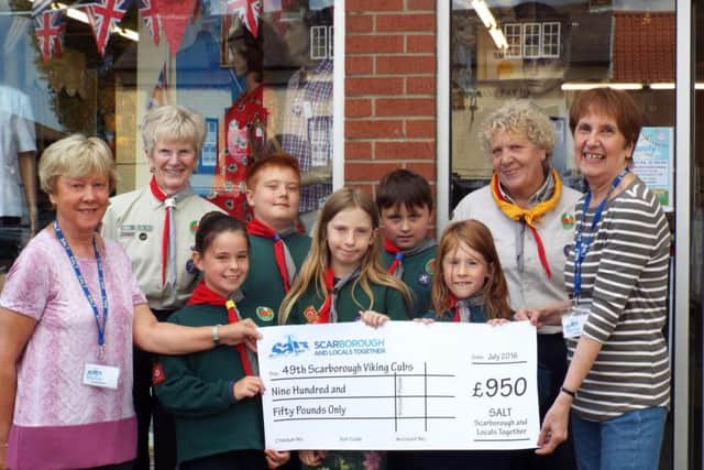 Representatives of S.A.L.T. present the £950 cheque to 49th Scarborough Viking Cubs
