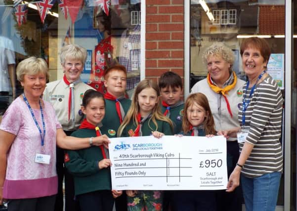 Representatives of S.A.L.T. present the Â£950 cheque to 49th Scarborough Viking Cubs