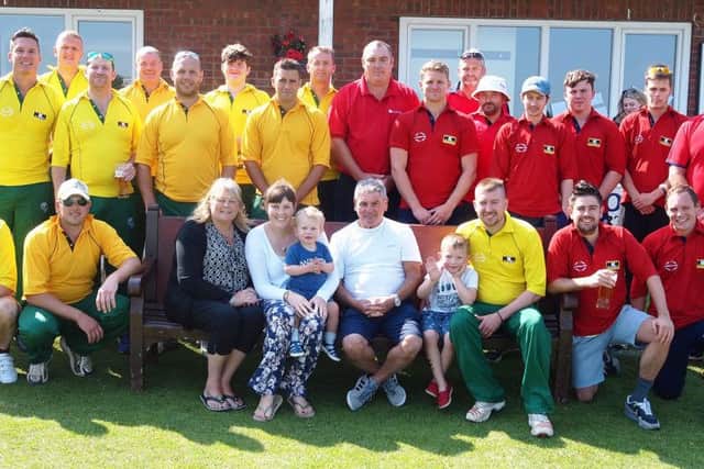 Players and family line up before last year's Gary Jones Memorial match