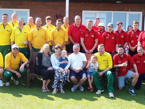 Players and family line up before last year's Gary Jones Memorial match