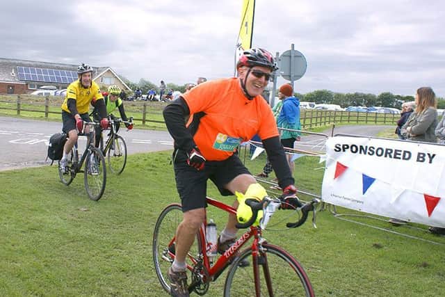 Caravan Guard chairman Peter Wilby crosses the finishing line in Filey.
