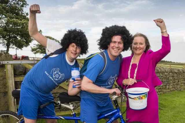 Castle Employments managing director Suzanne Burnett with tandem riders Eamonn Byrne and Chris Farbridge.