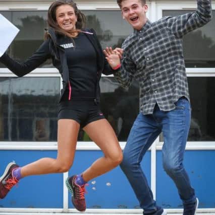 Maddie Mastrolonardo and Reece Gildroy jump for joy at their GCSE results at Caedmon College, Whitby. w163601a Picture: Ceri Oakes