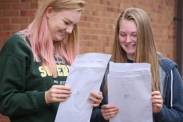 Ellie Tindall and Charlotte Robinson compare their GCSE results at Caedmon College, Whitby. w163601b Picture: Ceri Oakes