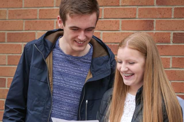 Josh Crabtree congratulated his friend Rosa Byatt-Goodall on her GCSE results at Caedmon College, Whitby. w163601c Picture: Ceri Oakes