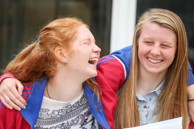 Friends celebrate their GCSE results at Caedmon College, Whitby. w163601d Picture: Ceri Oakes