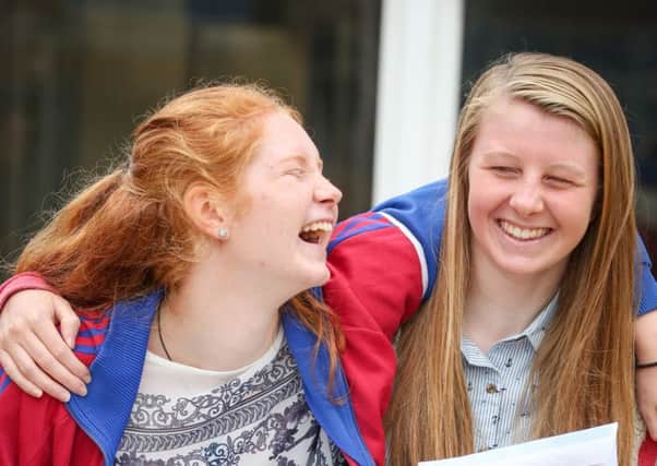 Friends celebrate their GCSE results at Caedmon College, Whitby. w163601d Picture: Ceri Oakes