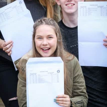 Bronte Nichola-Miller, Daniel Morris and Poppy Draper with their GCSE results at Caedmon College, Whitby. w163601f Picture: Ceri Oakes