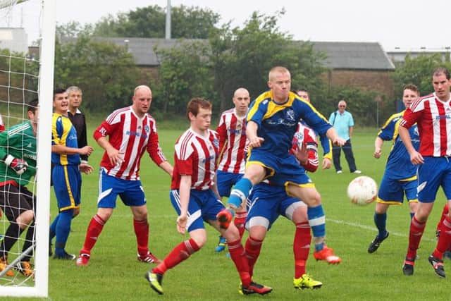 Hunmanby United, striped kit, beat local rivals Filey Town. Picture: Steve Lilly