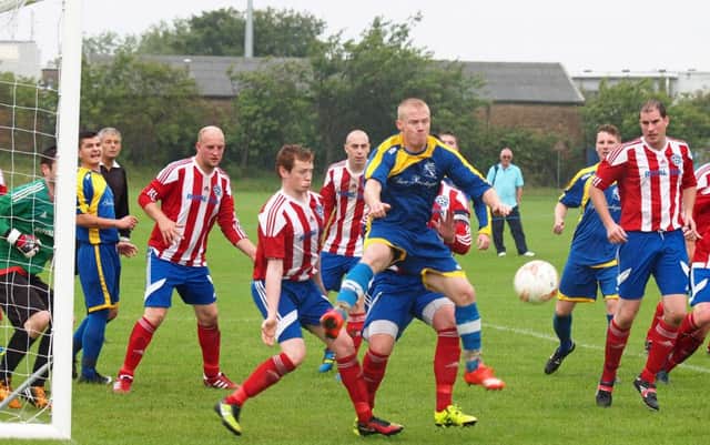 Hunmanby United, striped kit, beat local rivals Filey Town. Picture: Steve Lilly