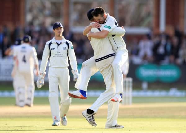 Middlesex's Toby Roland-Jones celebrates after taking the wicket of Yorkshire's Andy Hodd.