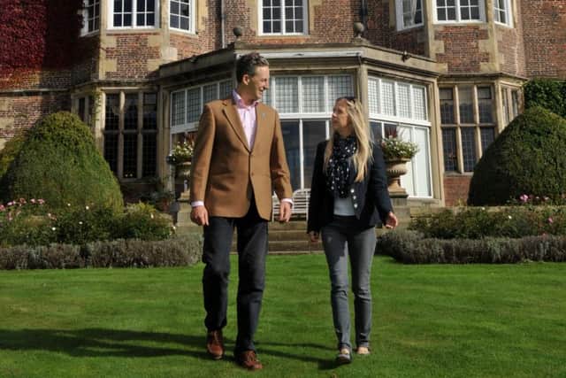 Clare and Mark Oglesby owners of Goldsborough Hall, Goldsborough near Knaresborough in the garden outside the hall.
