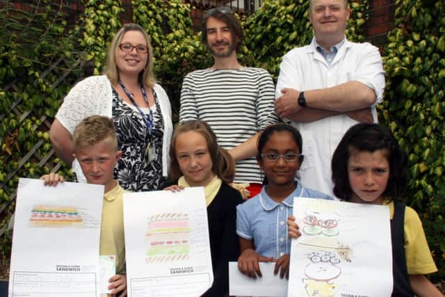 In the picture are (back row, from left): Friarage Primary School teacher Vicky Hollings, Adrian Riley, representing Create Marketing, and Ian Hutchinson from Horsleys butchers. Front row: Competition winners Oakley Kelley, Ola Jankowska, Mahima Aziz and Holly Taylor.