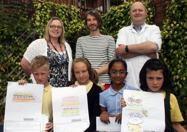 In the picture are (back row, from left): Friarage Primary School teacher Vicky Hollings, Adrian Riley, representing Create Marketing, and Ian Hutchinson from Horsleys butchers. Front row: Competition winners Oakley Kelley, Ola Jankowska, Mahima Aziz and Holly Taylor.