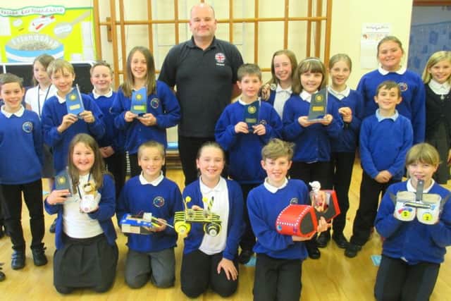 Hertford Vale Primary Schools Year 6 pupils with their Engineering Week awards and power boats.