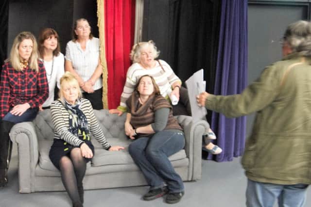 The cast of The Haunting of Hill House and its director Mel Jones in rehearsal