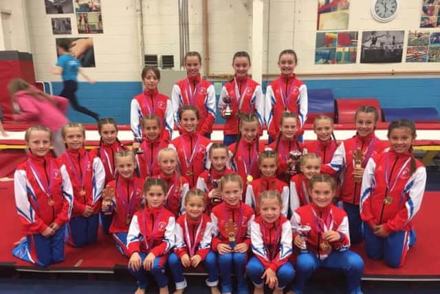 The successful Bridlington Gymnastics club members show off their array of medals at the Hull-based event