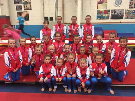 The successful Bridlington Gymnastics club members show off their array of medals at the Hull-based event