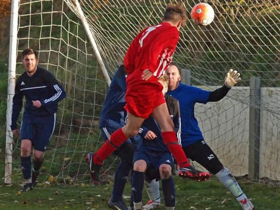 Edgehill Reserves head in one of their 13 goals against Falsgrave. Picture: Steve Lilly