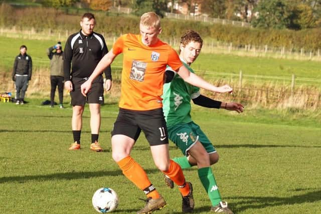 Taylor Jordan (orange) netted for Scalby Reserves in their 4-1 win at home to Fishrburn Park Reserves. Picture: Steve Lilly.