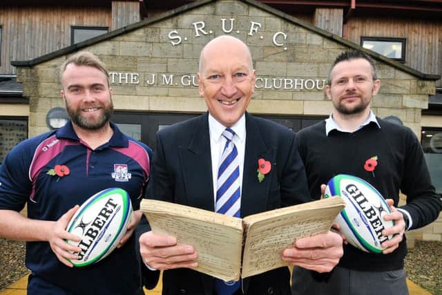 Scarborough RUFCs YDO Graham Hogg, left, 90th anniversary steering committee chair Dr David Coates with the historical book, centre and chief operations manager Graeme Jeffrey       PICTURE BY RICHARD PONTER