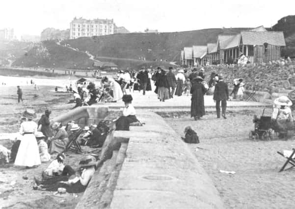 In this picture of Edwardian folk at leisure the extent of Scarborough's North Bay promenade can be seen as the straight edge of concrete paving meets the sand.
The promenade was extended northwards in 1925 as far as the bulge where Peasholm Dale met the shore.
Dominating the skyline in the distance is the Clifton Hotel.
Photo reproduced courtesy of the Max Payne collection. 
Reprints can be ordered with proceeds going to local charities. Telephone 0330 1230203 and quote reference number