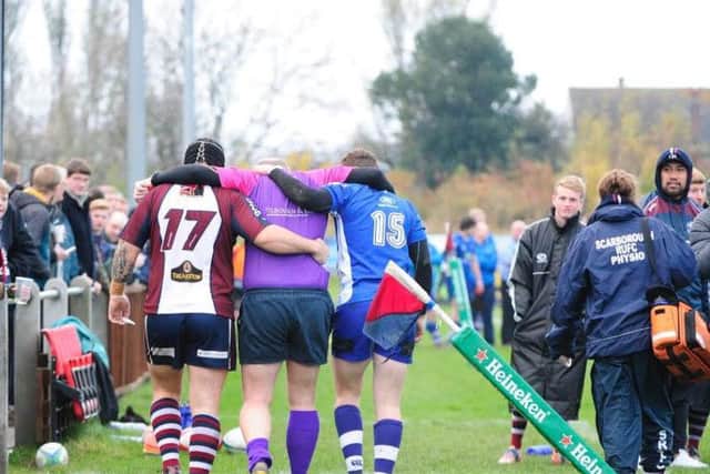 The ref is helped from the field