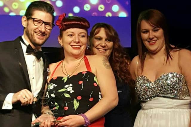 The Woodlands team pick up their award at the Leeds ceremony.