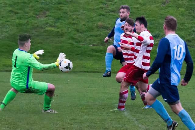 Whitby Fishermen (above scoring against Cayton last week) host Newlands in Division One