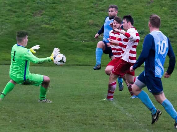 Whitby Fishermen (above scoring against Cayton last week) host Newlands in Division One