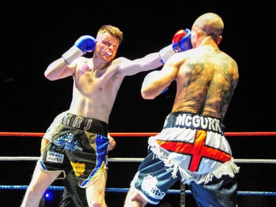 George Rhodes lands a left hand on Peter McGurk. Picture: Andy Standing.