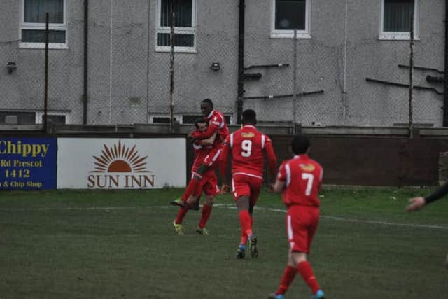Jameel Ible celebrates his goal with Adam Bolder