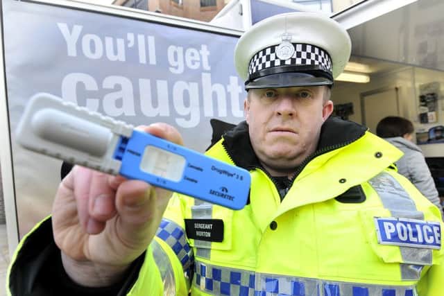 Sgt Andy Norton with a drugs testing device.165025e
