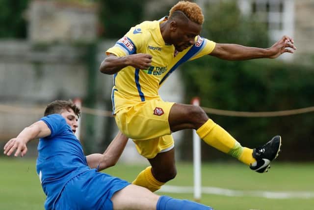 Alhassane Keita in action against Pickering Town