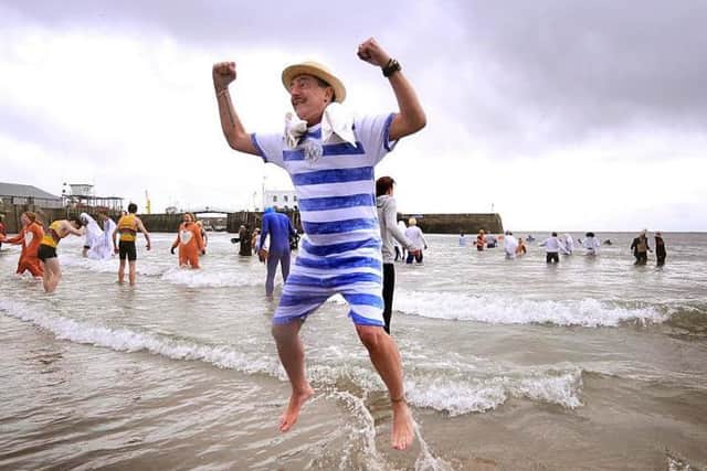 Leaping with delight as he exits the sea