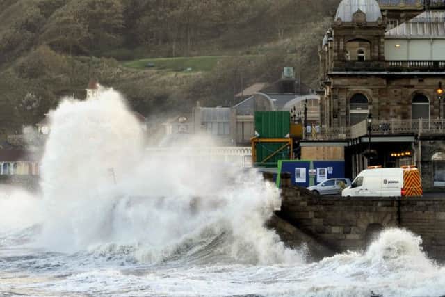 A flood alert has been issued at The Spa in Scarborough. Pictured: waves crashing against the sea wall in 2010.
