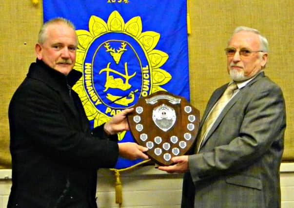 Councillor Harvey Stockdale presents the Community Spirit award to David Wells