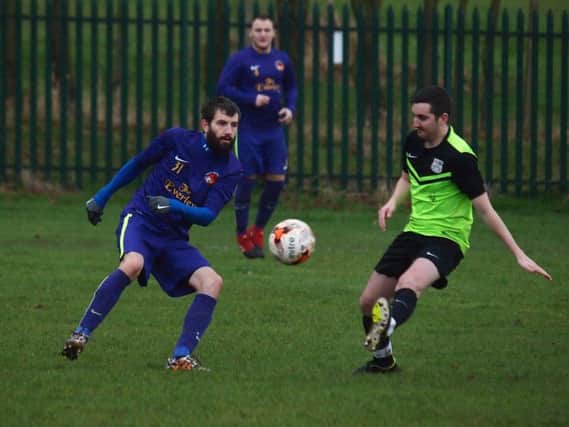 Goalsports get on the ball during their 7-0 win at Rosette. Picture: Steve Lilly