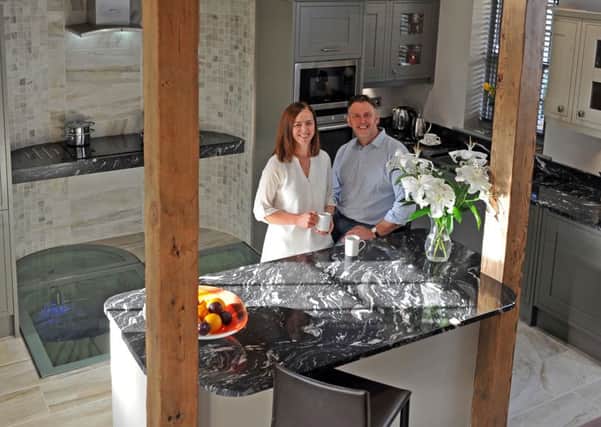 Maxine and Alan in the kitchen of their home, which was fashioned from a Georgian coach house.