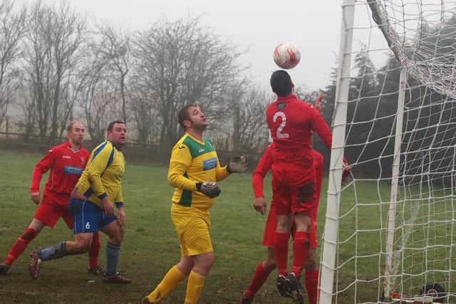 Matt Griffiths clears on the line with Newlands keeper Martin Cappleman beaten. Newlands hammered West Pier 8-0 to land a huge blow in the title race. Picture by Steve Lilly.