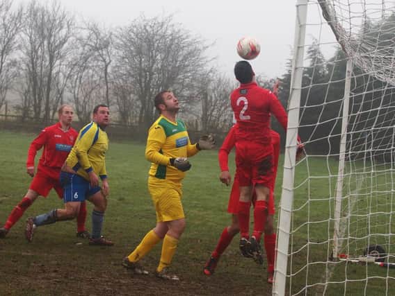 Matt Griffiths clears on the line with Newlands keeper Martin Cappleman beaten. Newlands hammered West Pier 8-0 to land a huge blow in the title race. Picture by Steve Lilly.