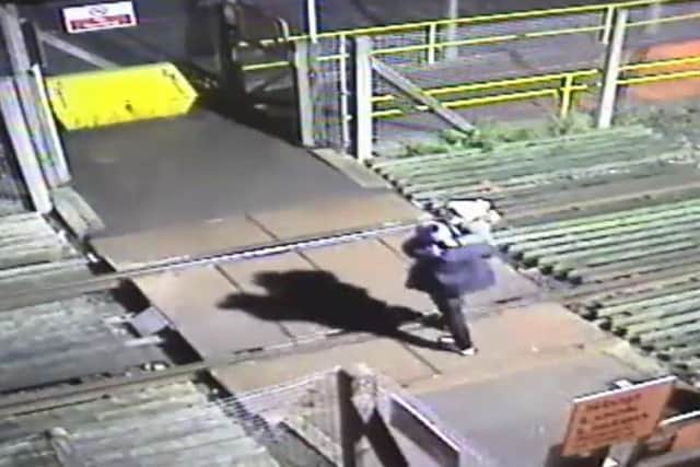 The man runs across with a toddler