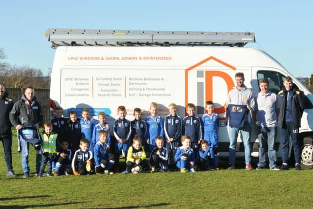 Seamer Spartans and Scorpions line up with their sponsors
