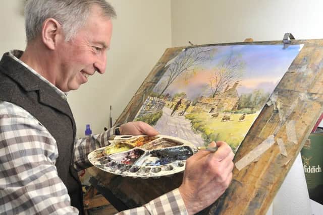 Boynton watercolour artist Andrew Storrie working on his latest piece in his home studio.