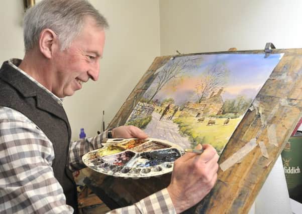 Boynton watercolour artist  Andrew Storrie working on his latest piece in his home studio.