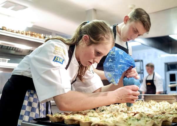 Finalists Jemima Harpin and Kurtus Auty in the kitchens of the Pipe and Glass Inn during the finals of the last Golden Apron competition.
picture: Tony Bartholomew.